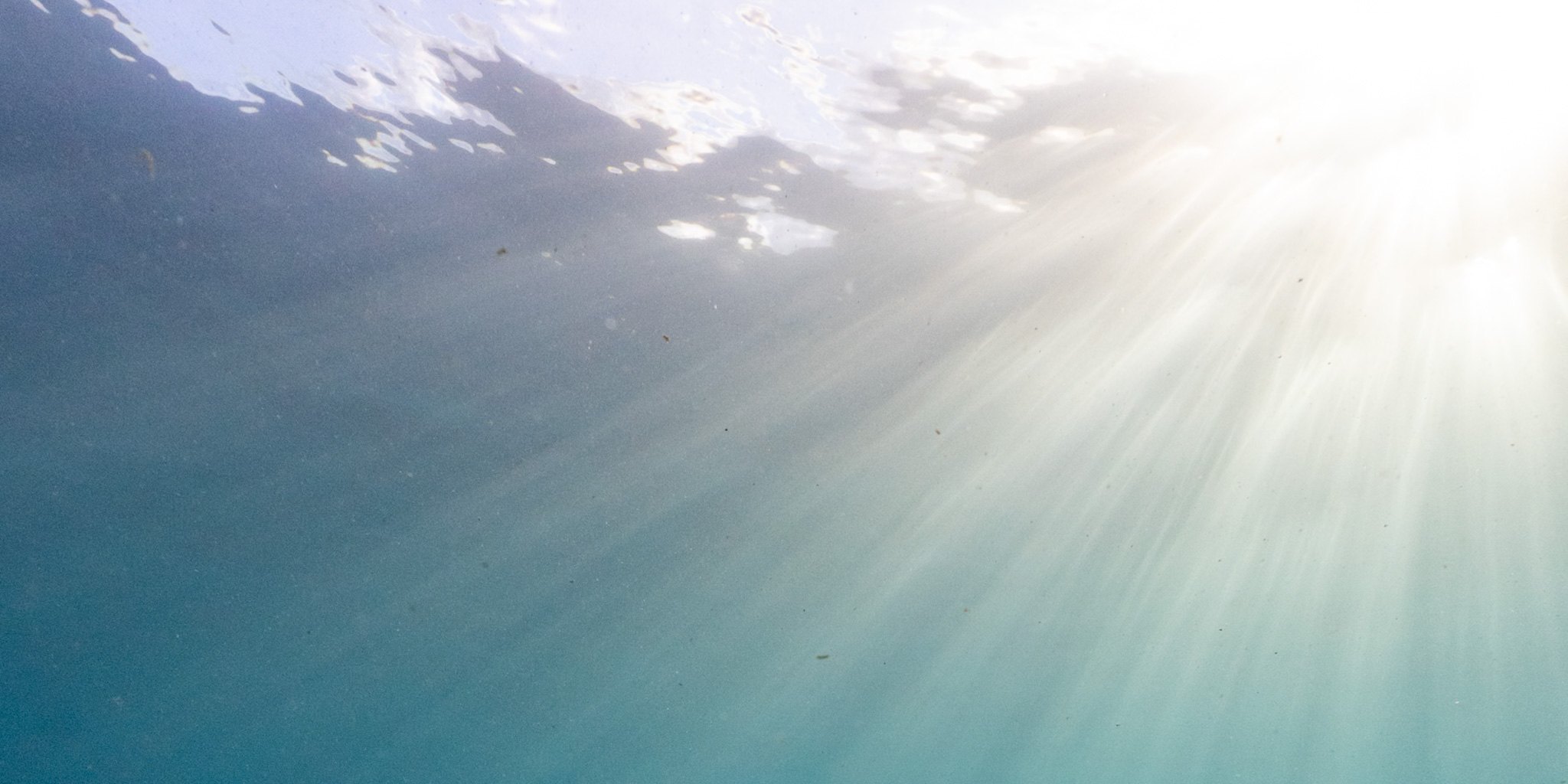 Soft rays of light through clear ocean water